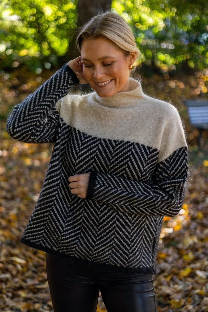 Front view of a versatile women's high collar loose knit pullover sweater, perfect for casual winter days.