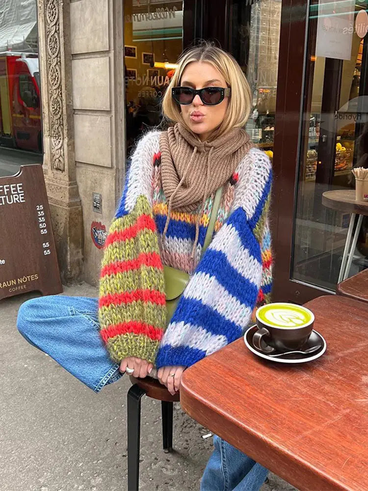 Fashionable women's blue multicolor knit sweater, perfect for casual winter outfits and warmth.