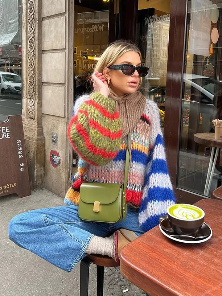 Chic women's knitwear: multicolor winter sweater featuring long sleeves and comfortable crew neck design.