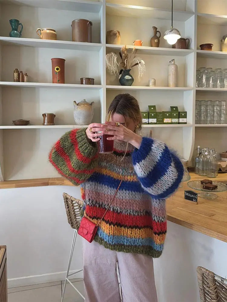 Warm women's long sleeve multicolor knit sweater, a stylish and cozy addition to winter fashion.
