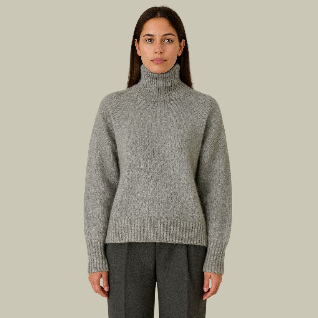 Cozy women's relaxed fit merino wool turtleneck sweater in beige, perfect for winter and fall fashion.