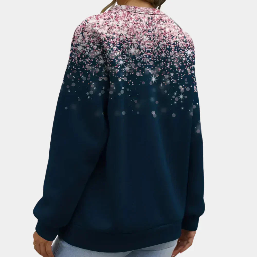 Detailed view of the sparkling star pattern on a women's festive knit Christmas sweater