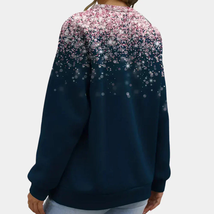 Detailed view of the sparkling star pattern on a women's festive knit Christmas sweater
