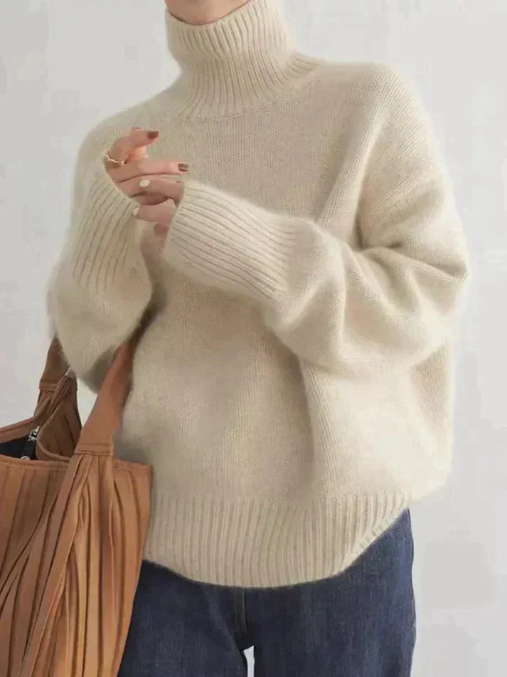 Cozy women's turtleneck sweater for winter. Elegant long sleeve knit pullover in relaxed fit, perfect for fall fashion.