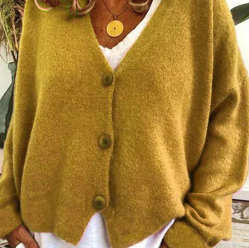 Stylish women's V-neck button-front cardigan in a warm cream knit, casual outerwear.