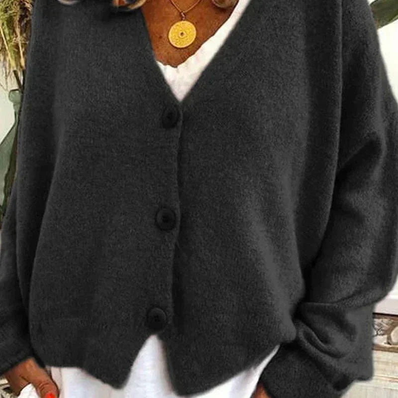 Soft knit women's V-neck cardigan, light blue, features classic button detailing.