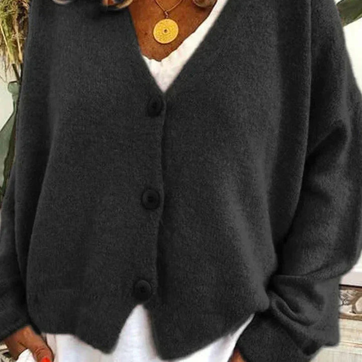 Soft knit women's V-neck cardigan, light blue, features classic button detailing.