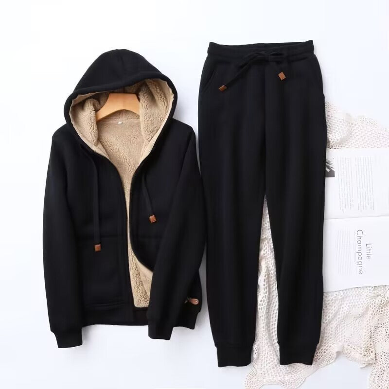 Cozy women's winter hoodie and jogger set in a soft, light grey, perfect for loungewear or athleisure.