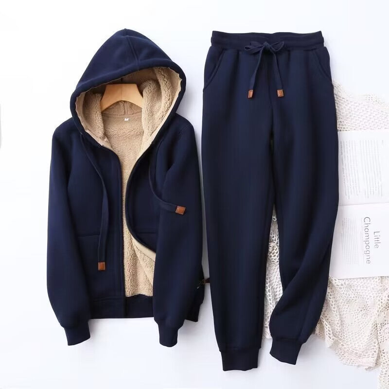 Close-up of the plush fabric of a women's winter hoodie and jogger tracksuit, highlighting its coziness.