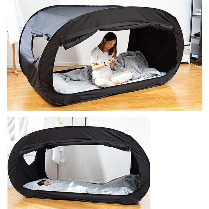 CozyNest black folding tent bed for camping, travel, or student dorms. Portable, lightweight sleep solution.