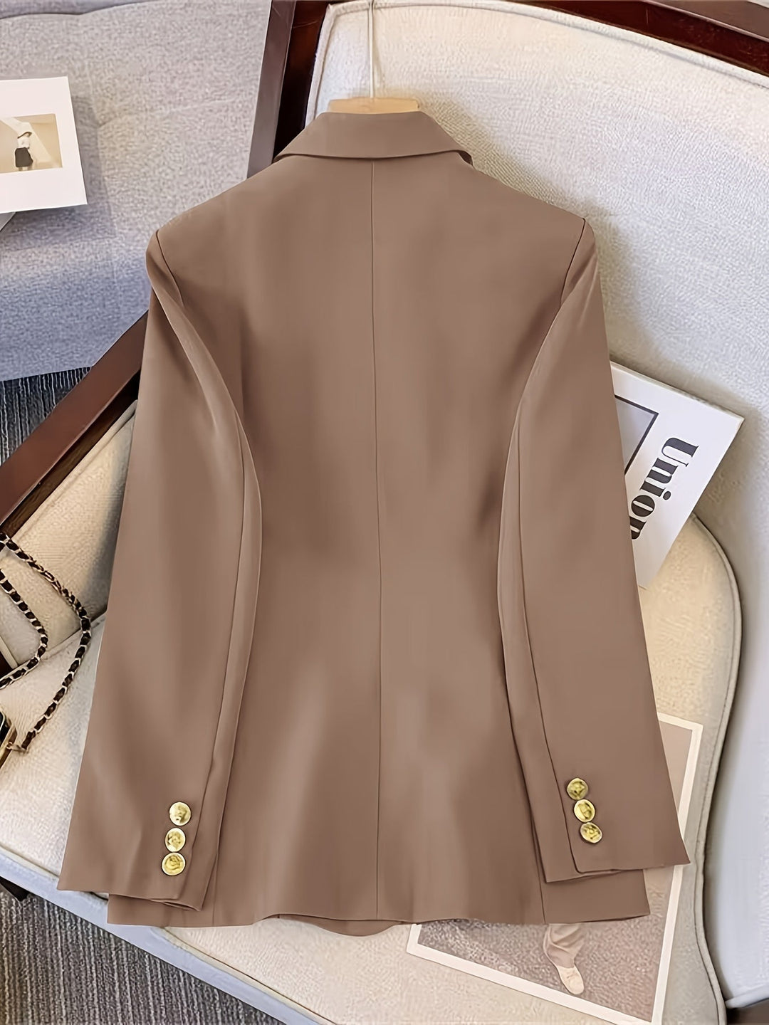 Stylish camel tailored women's jacket, featuring a double-breasted cut for winter fashion.