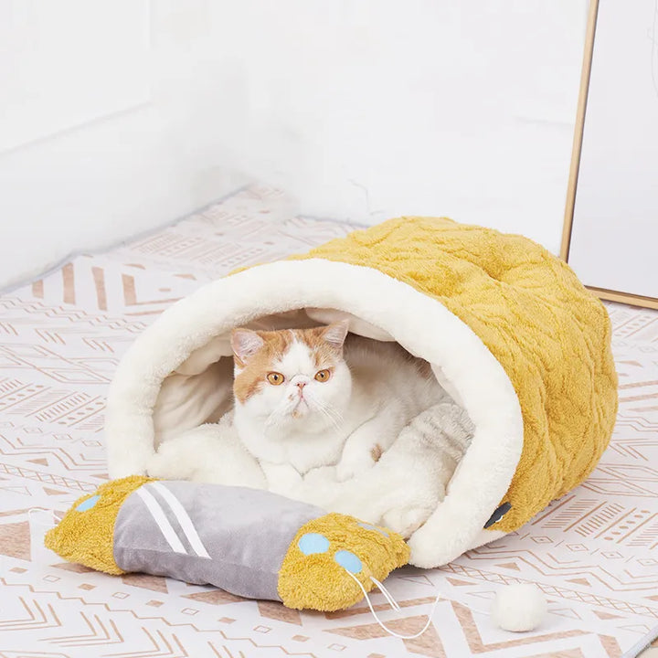 Cozy animal bed for cats, providing a secure sleeping pad and an engaging toy for happy pet comfort.