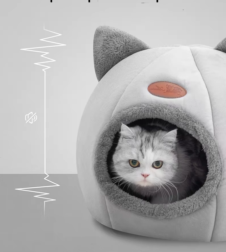Cozy warming cat bed, shaped like a playful cat, perfect for snuggling. Includes a soft removable cushion.