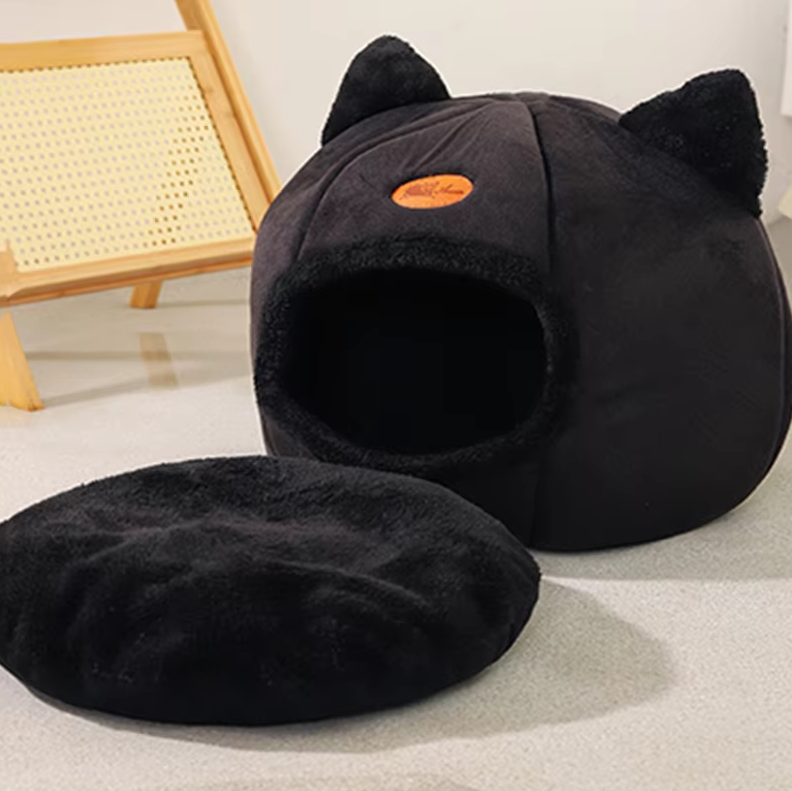 Unique cat-shaped design warming pet bed, a cuddly cat house for your furry friend. Removable cushion.