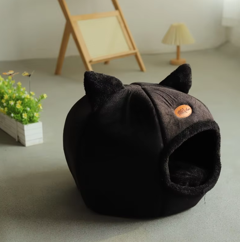 Premium cat-shaped warming pet supplies: a cozy cat house bed with a soft, removable cushion.