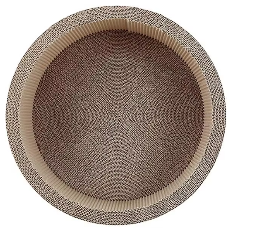 Cute round cat scratching mat for pets, providing essential claw care & effective furniture protection.