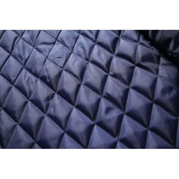 Stylized shot of men's dapper mid-length winter coat, hanging, classic design