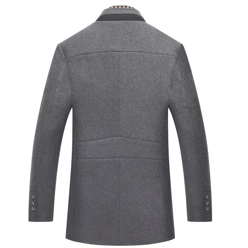 Warm men's dapper mid-length winter coat, wool blend, indoors, classic fashion