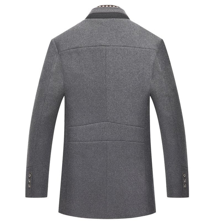 Warm men's dapper mid-length winter coat, wool blend, indoors, classic fashion