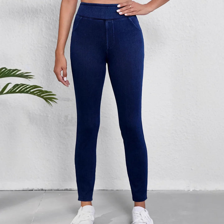 Dark blue women's slim fit high-rise stretch jeans, perfect for winter and casual everyday wear.