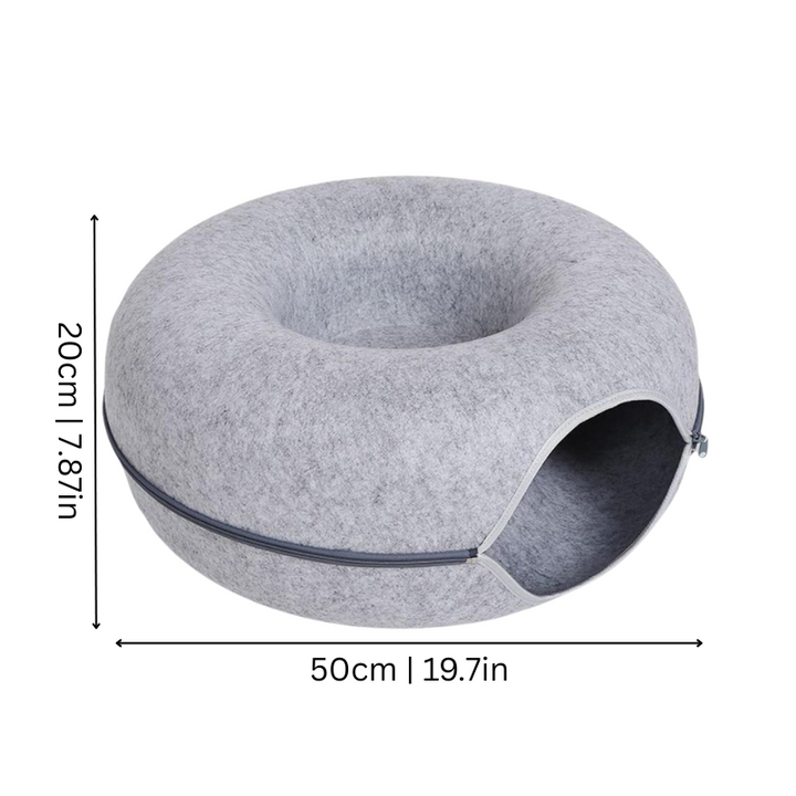 Washable donut-shaped grey cat bed for cozy pet comfort & stress relief. A purr-fect feline hideaway.