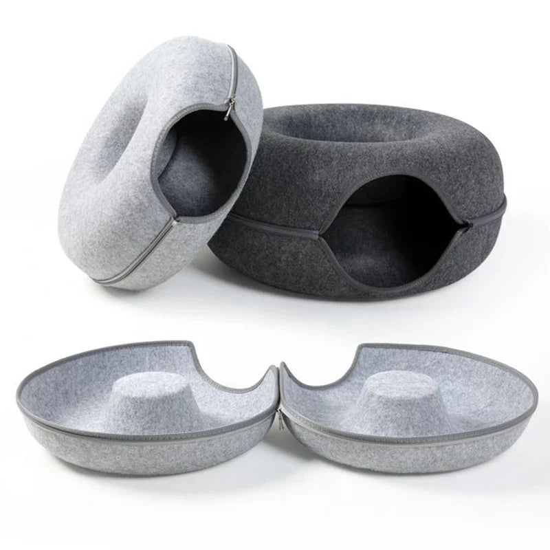Cozy grey cat cave bed, donut design, washable, provides feline comfort & a safe pet hideaway for play.
