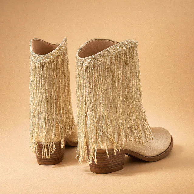 Women's glamorous sequin cowboy boots with long fringe. Pointed toe, block heel design for dazzling party fashion.