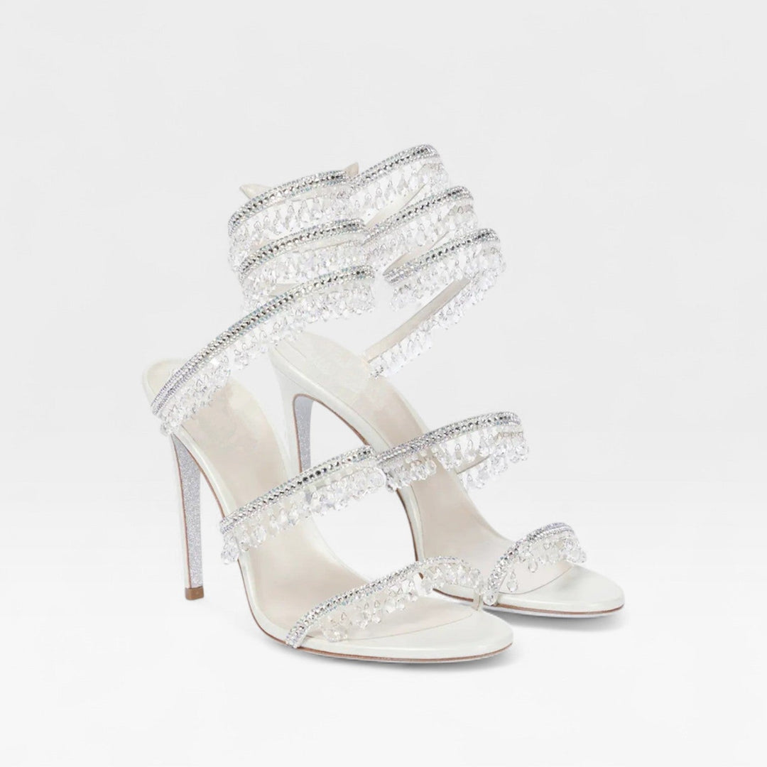Elegant women's embellished strappy high heel sandals, dazzling for formal occasions.