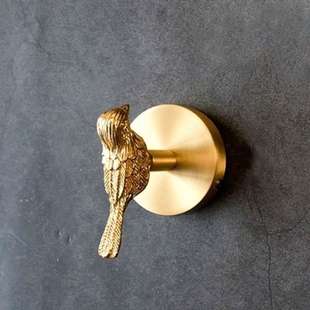 Decorative brass animal wall hook rack with gold accents for stylish home organization.