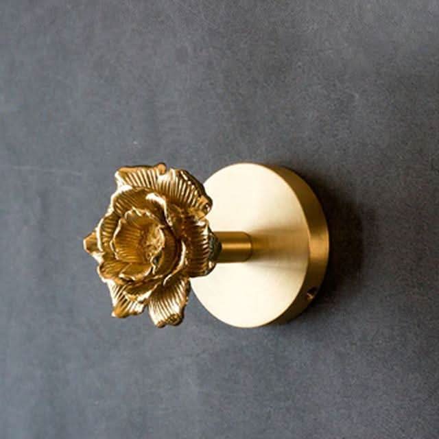 Charming brass animal wall hooks featuring gold tones, a lovely addition to nature-inspired decor.