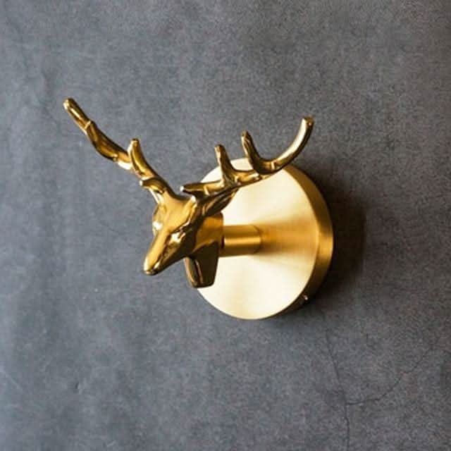 Artistic brass animal wall coat rack with elegant gold details, enhancing any room.
