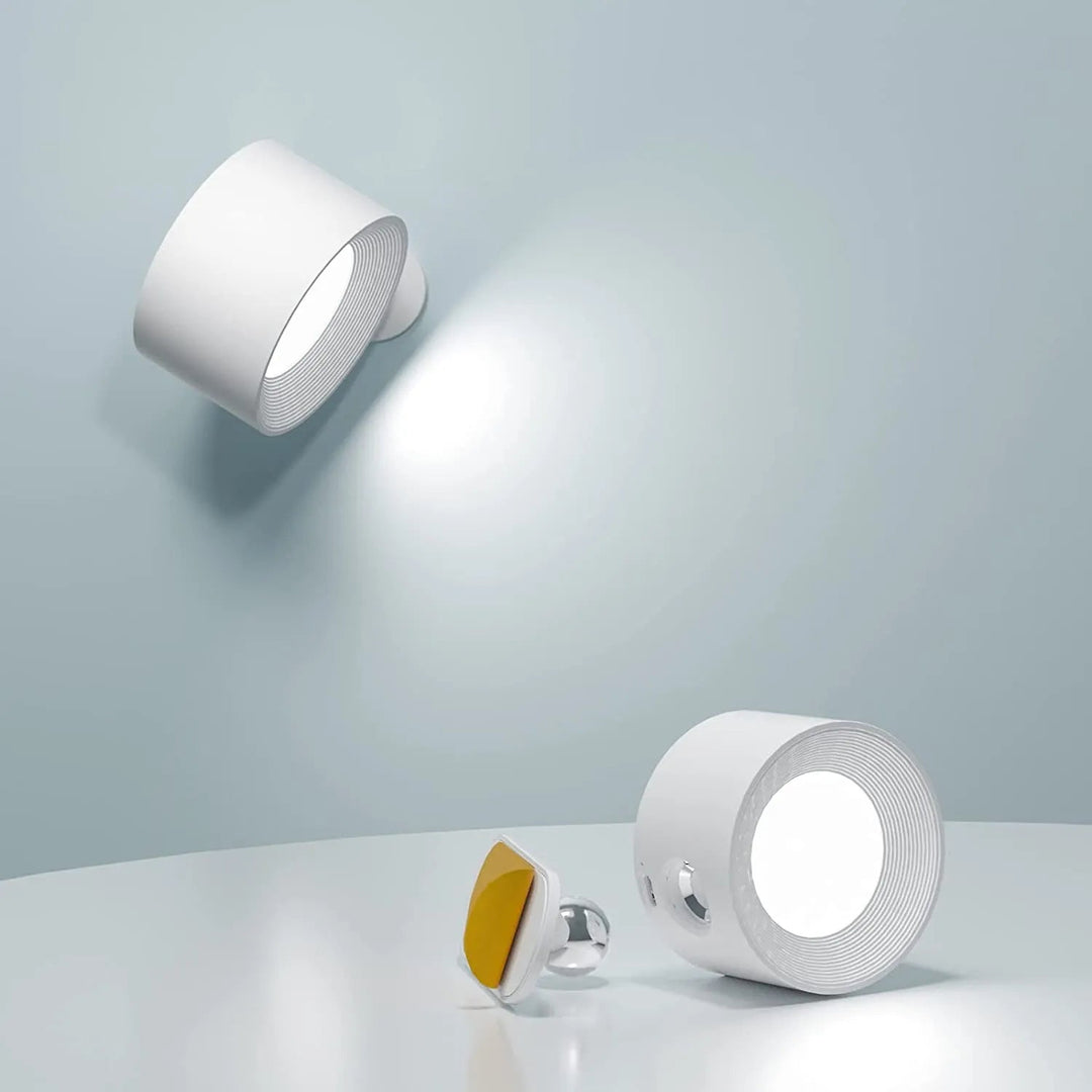 Dimmable wireless LED wall light, magnetic & rechargeable, providing modern home ambiance.