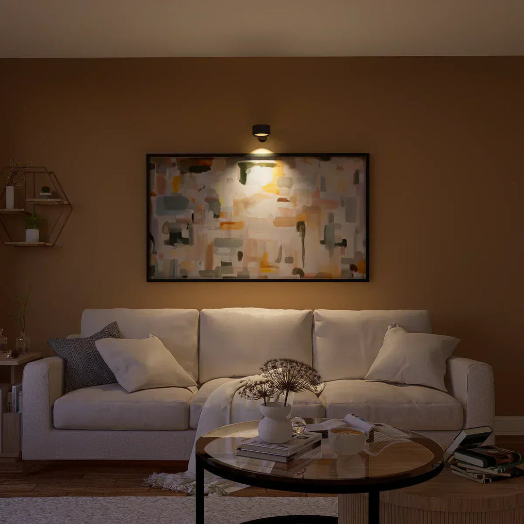 Modern dimmable wireless wall light, rechargeable LED offering adjustable ambiance.