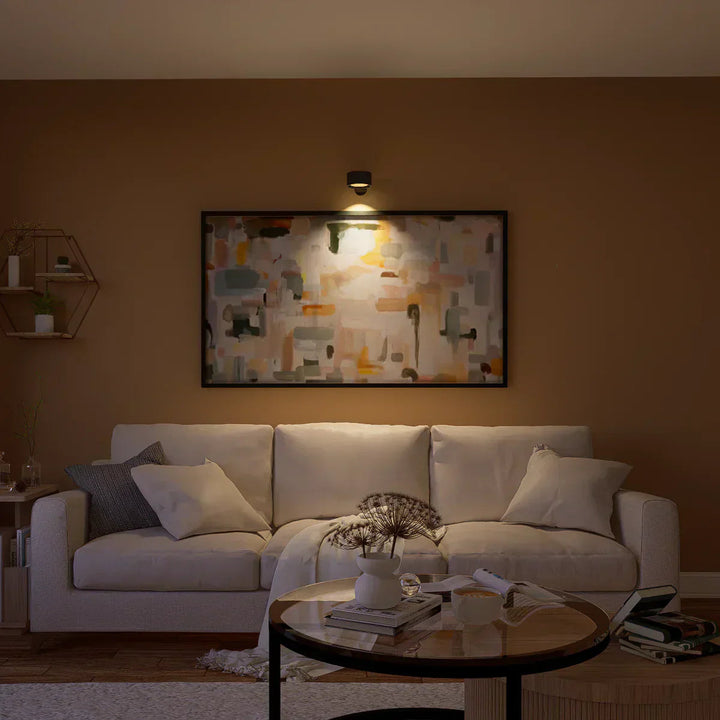 Modern dimmable wireless wall light, rechargeable LED offering adjustable ambiance.