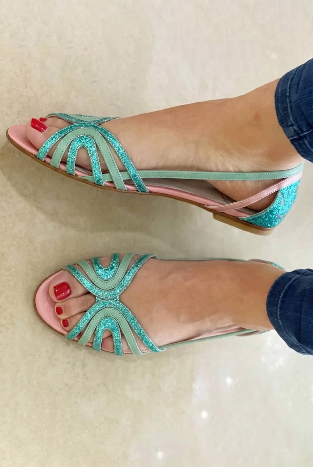 Stylish golden women's summer vacation sandals, comfortable open-toe slip-on design for warm days.