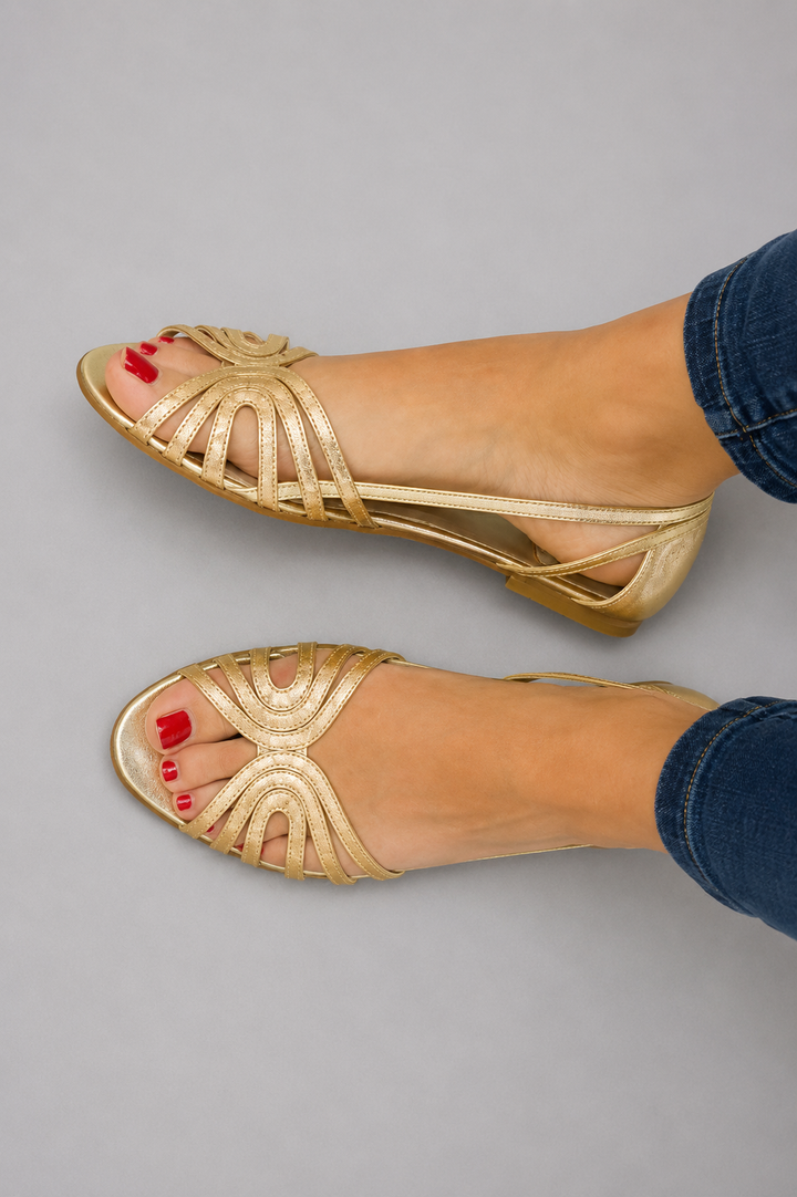 Chic golden flat slip-on sandals for women, offering ultimate summer comfort for beach & casual wear.