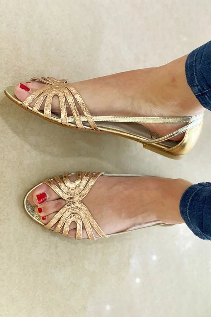 Golden slip-on women's summer sandals, perfect for comfortable warm-weather casual wear.