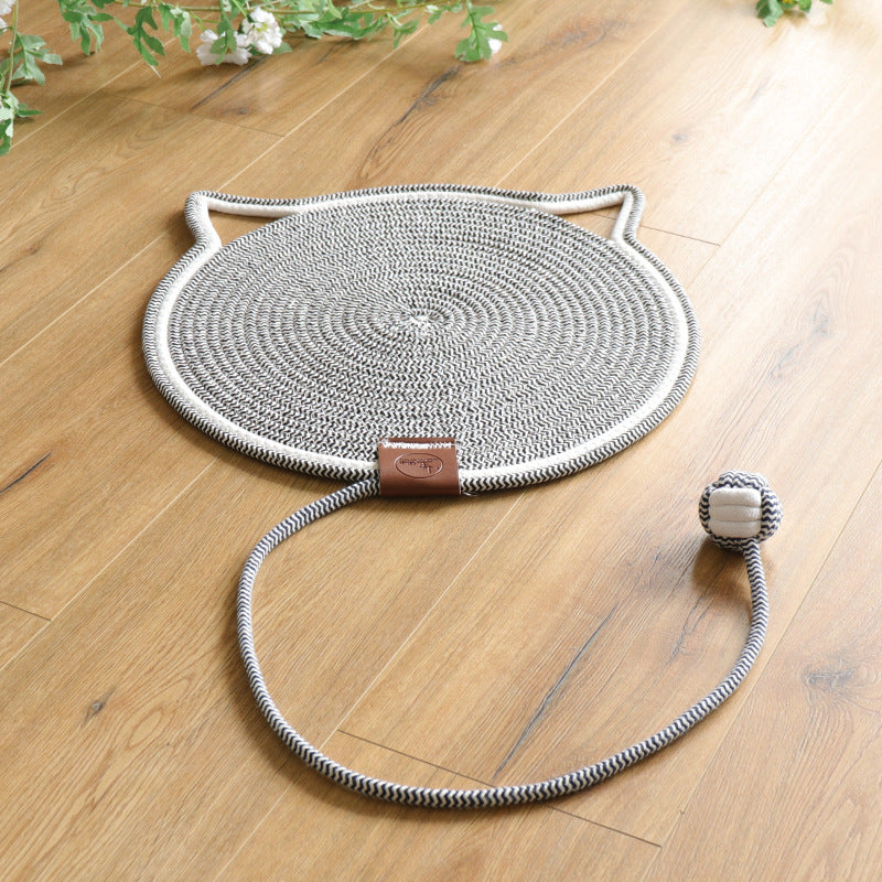 Happy cat scratching on a durable rug, ensuring claw care & protecting furniture from damage. Pet supplies.