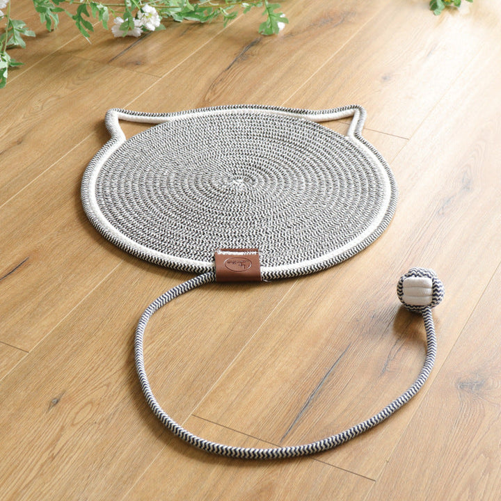 Happy cat scratching on a durable rug, ensuring claw care & protecting furniture from damage. Pet supplies.