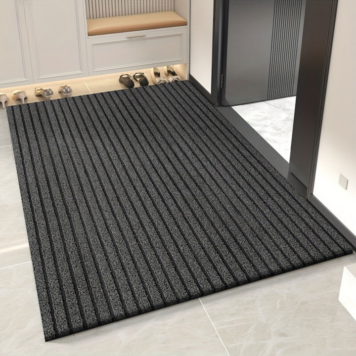 Hard-wearing gray outdoor entrance rug. Weatherproof and non-slip, perfect for busy entryways and hallways.