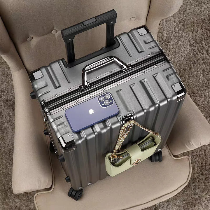 Secure vacation suitcase: durable hard shell, an integrated aluminum frame, and agile spinner wheels.