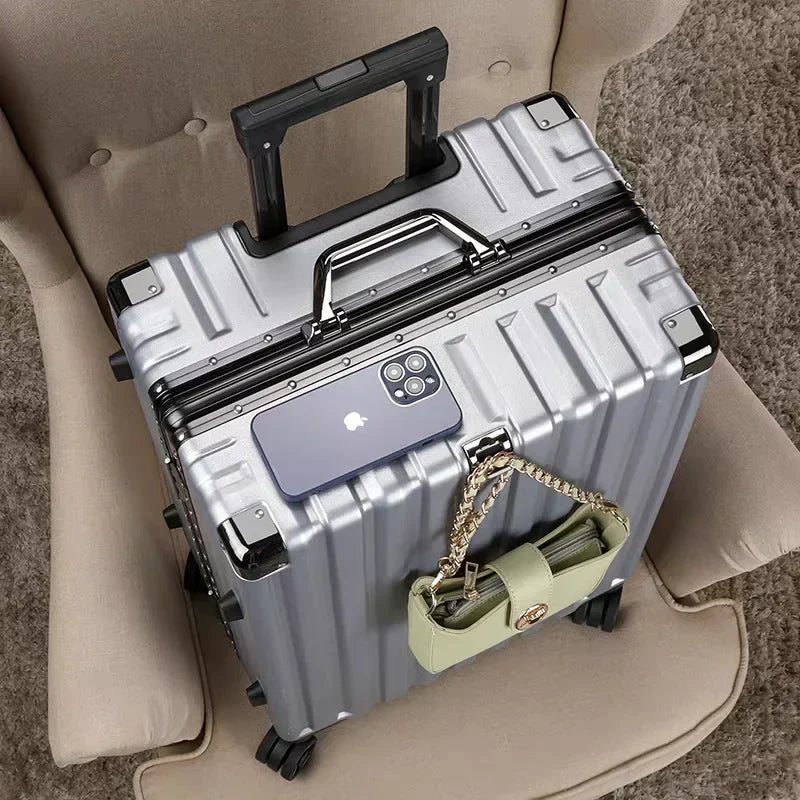 Robust hard shell luggage with integrated aluminum frame and four multi-directional spinner wheels.