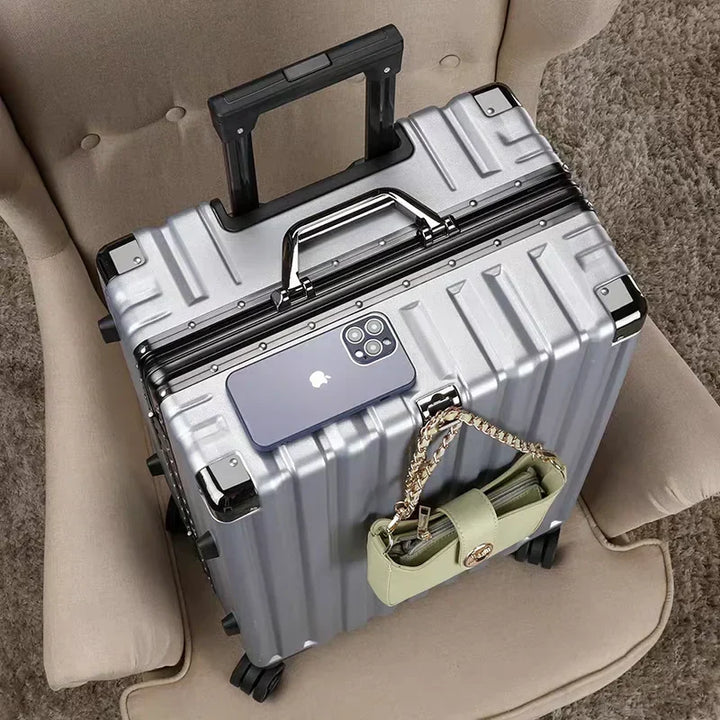 Robust hard shell luggage with integrated aluminum frame and four multi-directional spinner wheels.
