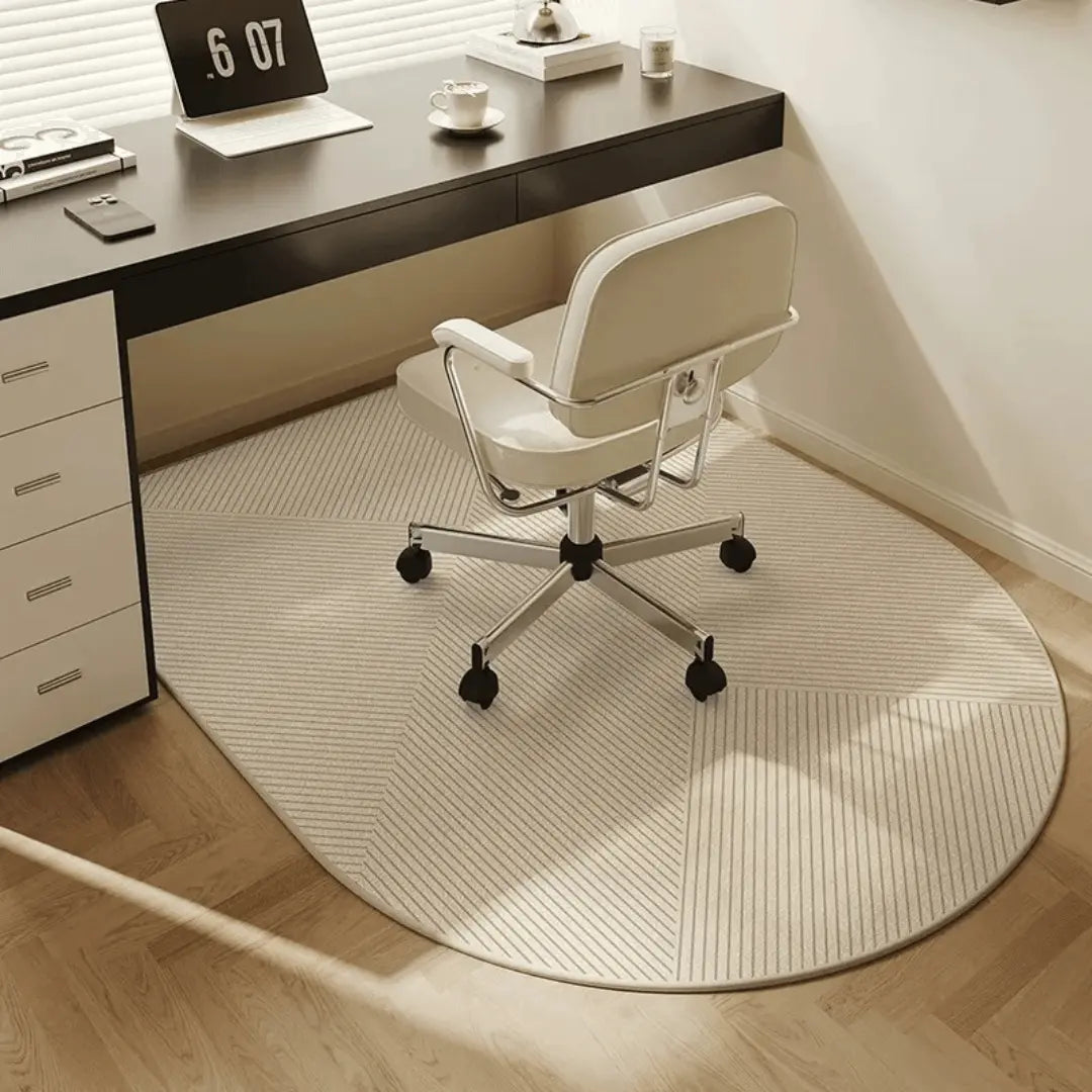 Non-slip office chair mat protecting hardwood & tile floors from chair damage, ensuring smooth castor movement.