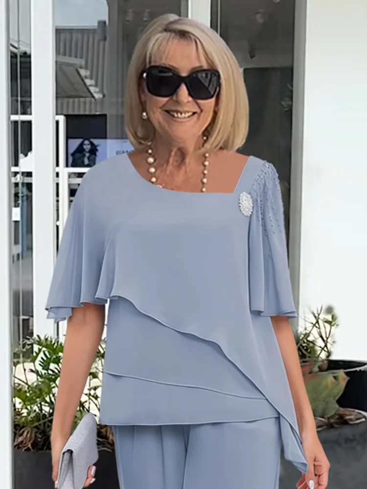 Stylish women's lounge wear set, an asymmetric top paired with flowing wide-leg pants for ultimate comfort.