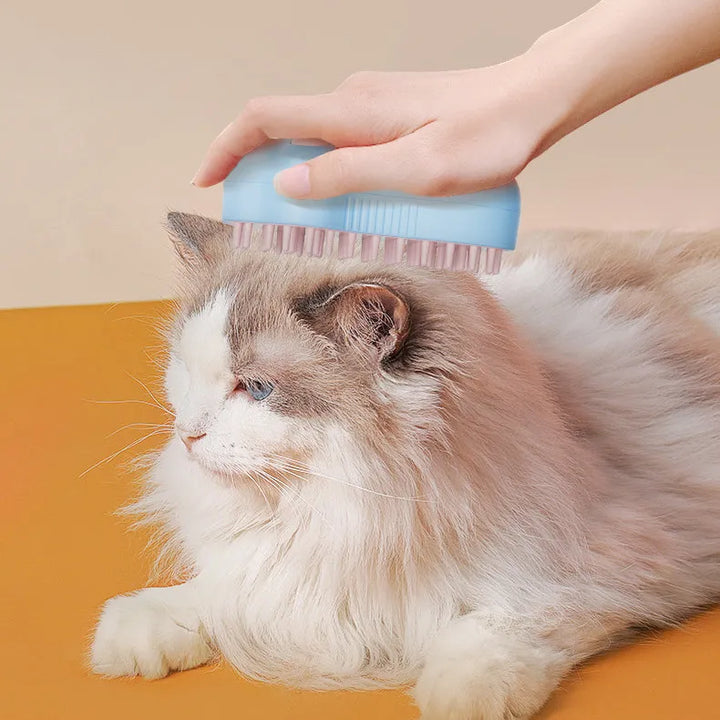 Electric cat grooming brush with massage function for deshedding & general pet care.