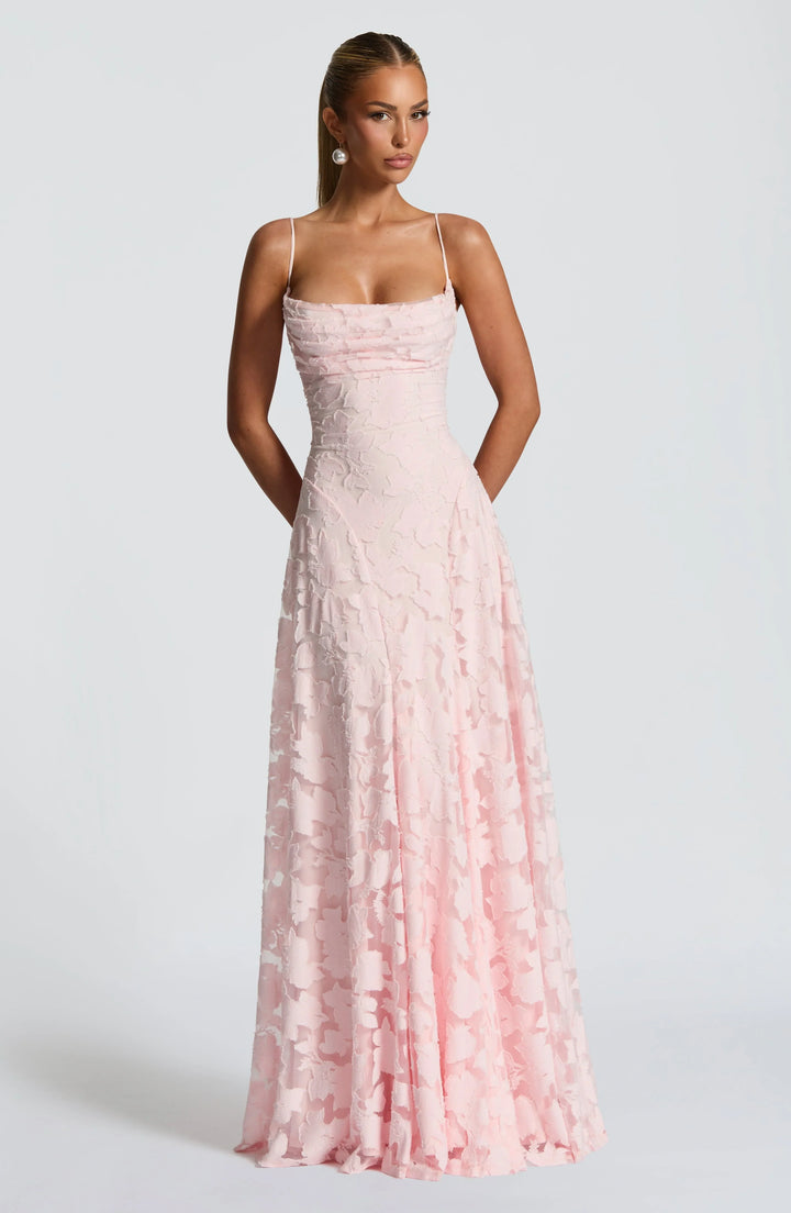 Flowy women's backless maxi dress with elegant spaghetti straps, perfect for formal summer events.