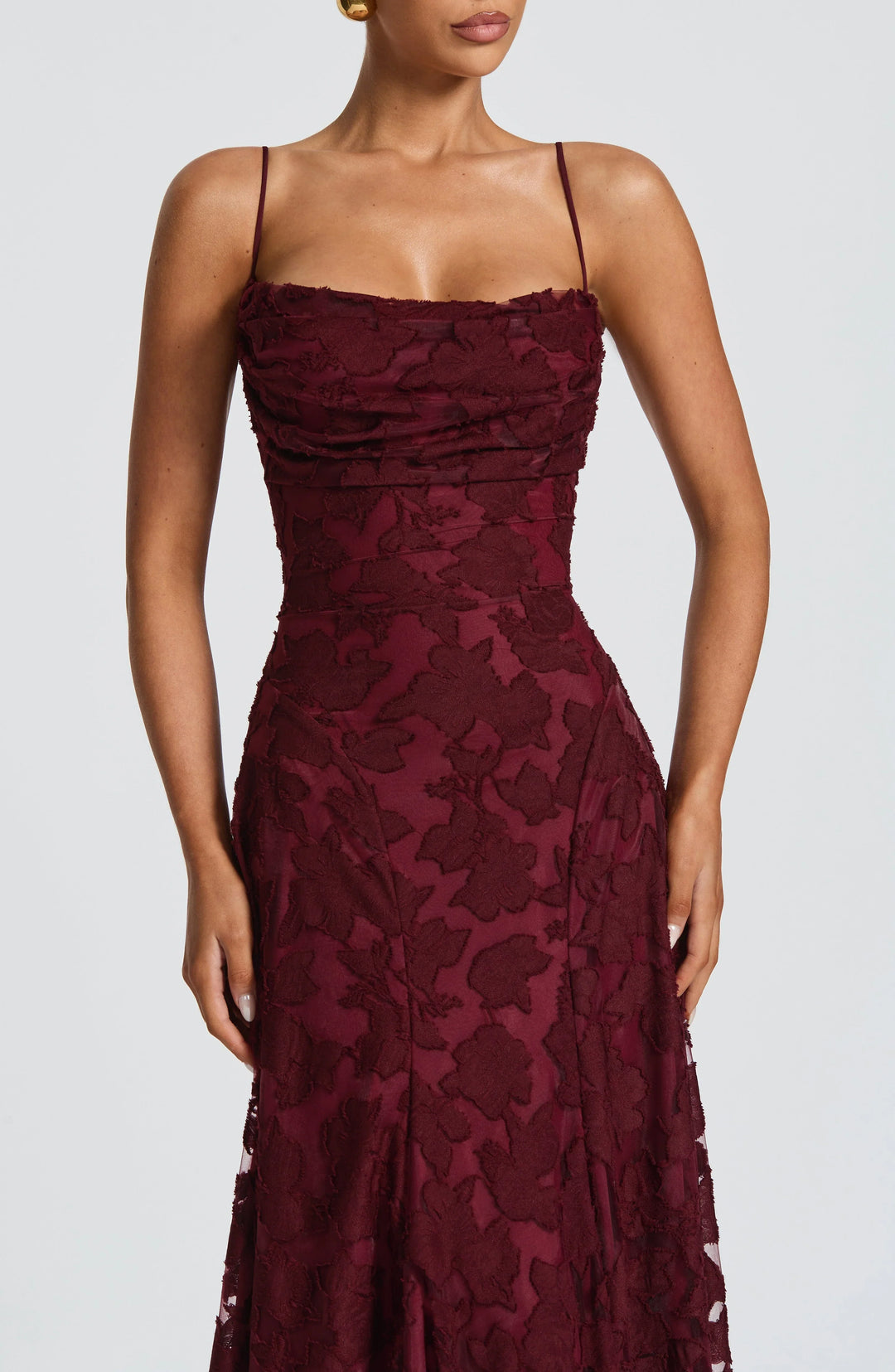 Flowy high-waist slip dress for women, elegant backless design with delicate spaghetti straps.