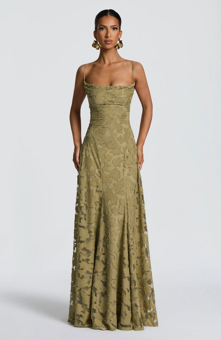 Backless spaghetti strap maxi dress for women, elegant & flowy, suitable for formal events.