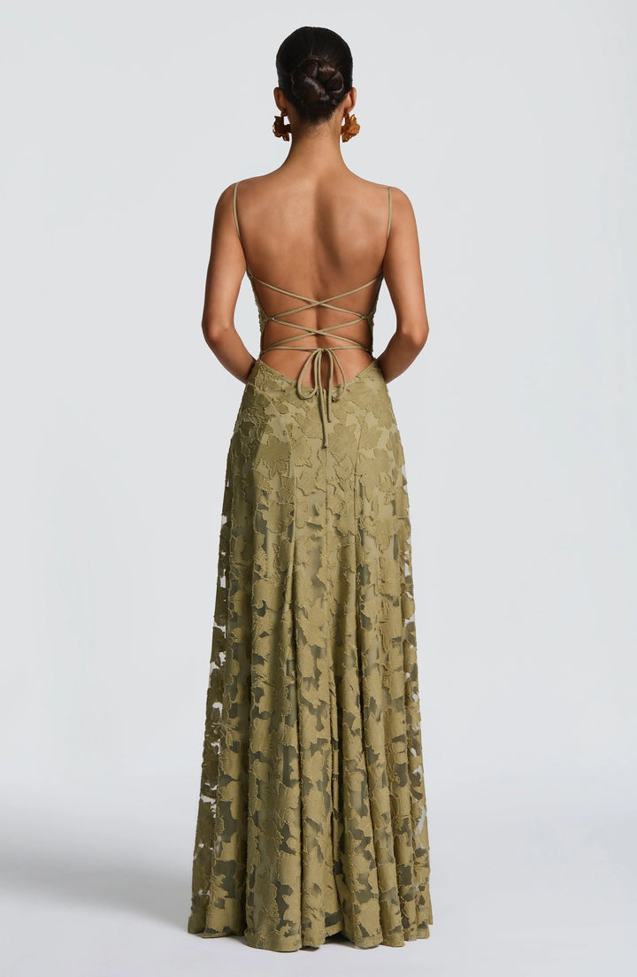 Formal women's maxi dress, backless, elegant design with spaghetti straps for special occasions.